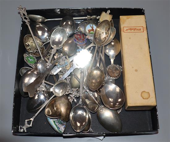 A group of assorted silver and plated spoons including souvenir.